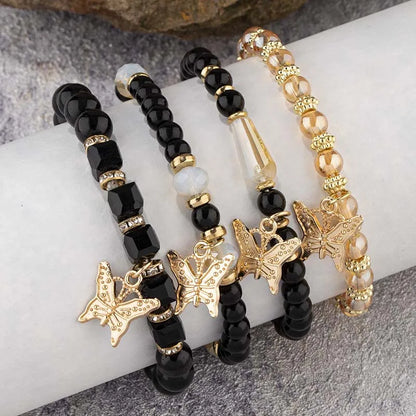 4-Piece Bohemian Butterfly Charm Bracelet Set – Crystal Beads & Stylish Layered Design